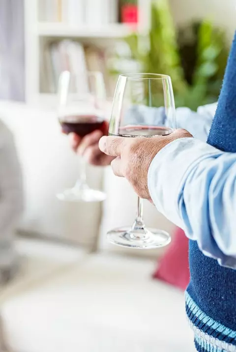 Seniors holding wine glasses