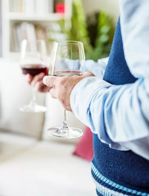 Seniors holding wine glasses