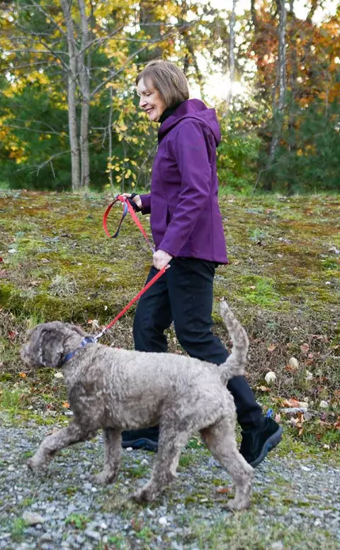 Woman walking dog