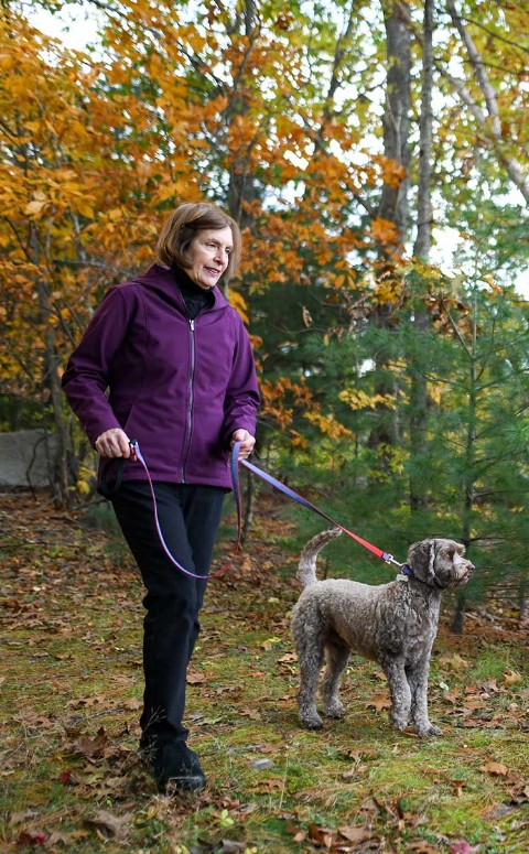 Woman walking dog