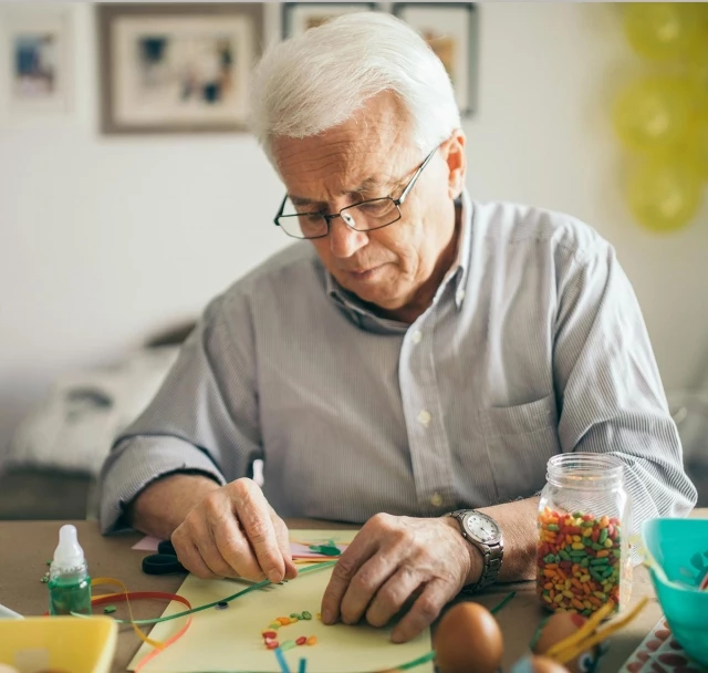 Senior man doing crafts