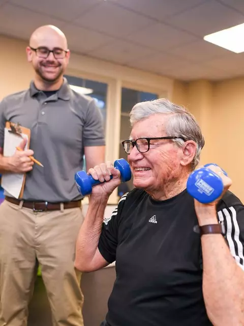 Senior man lifting weights