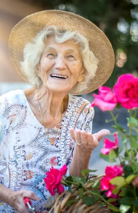 Senior woman with flowers