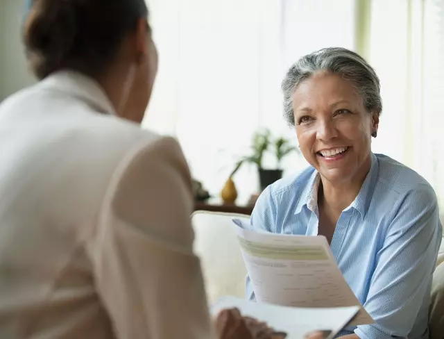 Senior woman and financial planner discussing finances