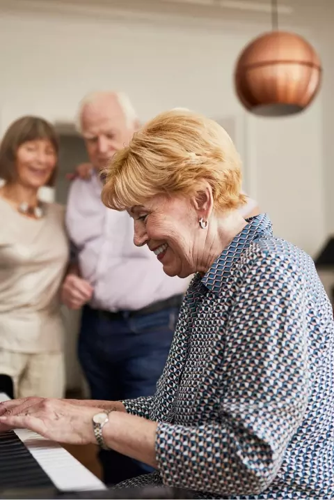 Senior woman playing piano