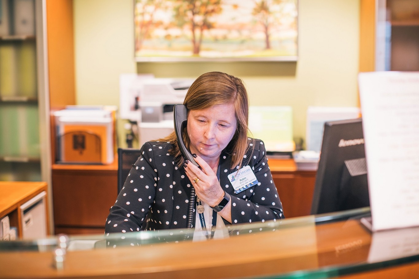 Receptionist speaking on phone