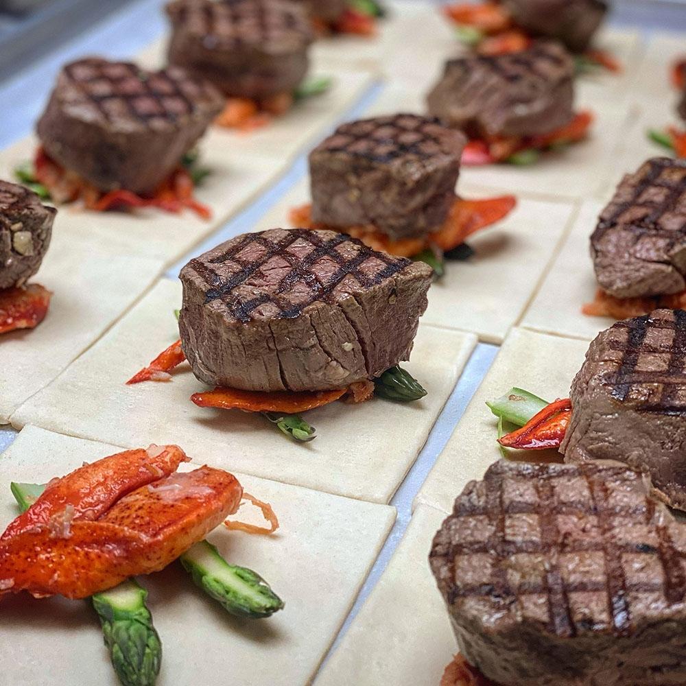Steaks over lobster and asparagus