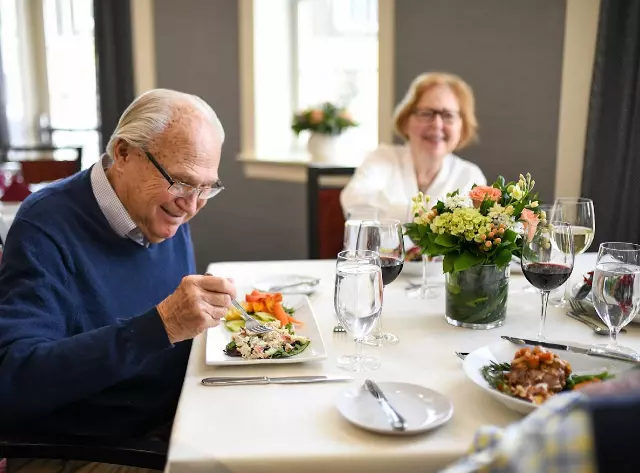 Senior man eating salad