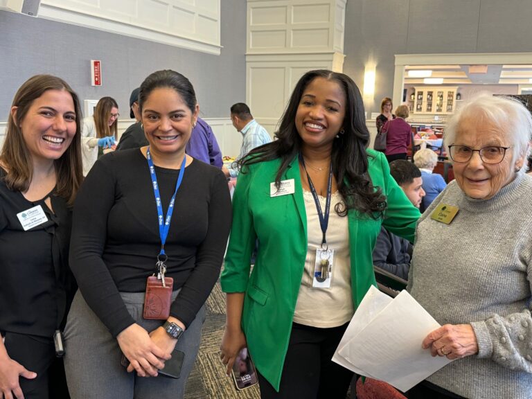 resident and associates posing together