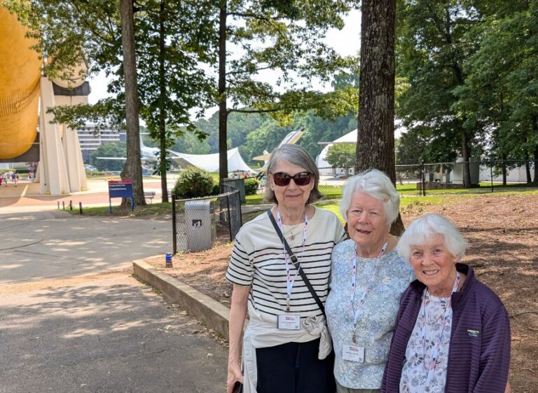 Caroline Jacobs Caroline Jacobs with neighbors and travel buddies Joanne L. and Isabelle D., exploring the Grand Ole Opry, Paducah quilts, and the U.S. Space & Rocket Center.