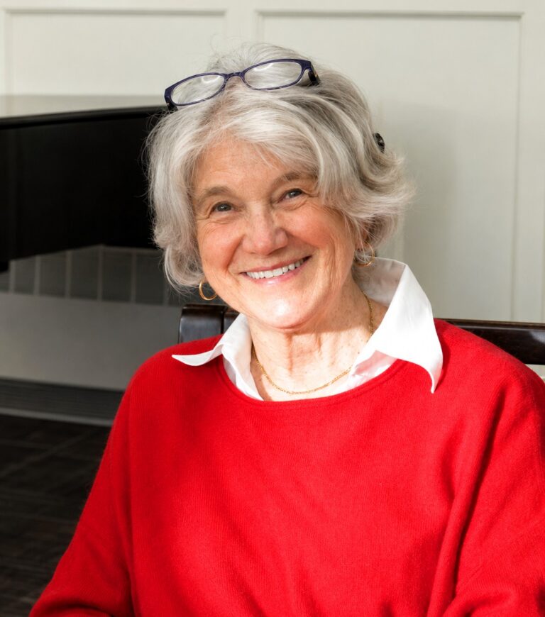 Prudy Van Winkle smiles while seated at The Commons in Lincoln, where she encourages fellow residents to explore lifelong learning opportunities through the OLLI program.