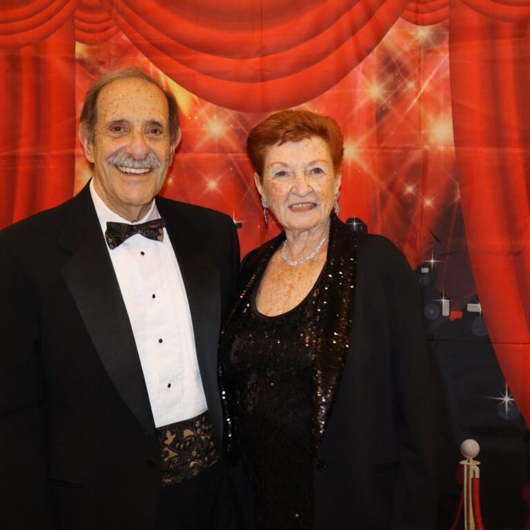 Ellen and Stu K. smile together in formal attire at The Commons in Lincoln’s Oscars celebration.